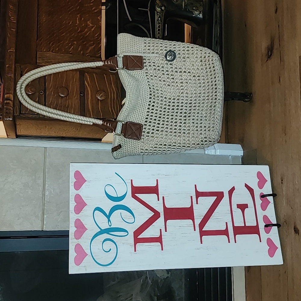 The sak crochet purse with metallic fabric under the crocheting on the front!